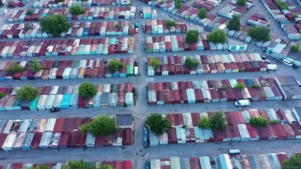 Flying a drone over a plethora of multi-colored metal storage containers — Stock Video