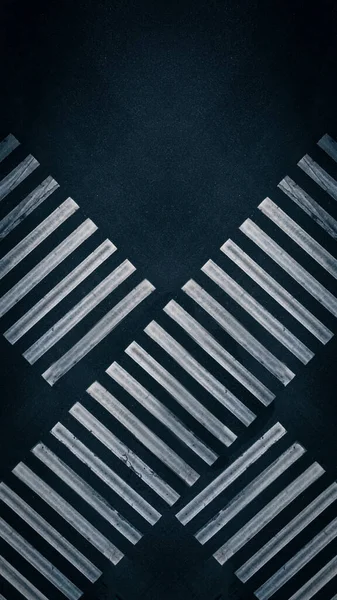 Crossing White Stripes of Zebra Pedestrian Crossing on Dark Asphalt - Top View Shot