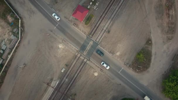Cars move the railway crossing, aerial drone shot — Stock Video