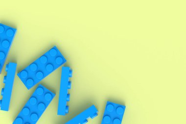Sarı arka planda dağınık plastik oyuncak blokları. Gelişmekte olan çocuklar için dikdörtgen şekilli yapıcı. Anaokulunda eğitim için tuğlalar. İnşaatçının parçaları. Uzayı kopyala 3d oluşturma