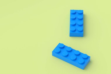 Sarı arka planda mavi plastik oyuncak blokları. Gelişmekte olan çocuklar için dikdörtgen şekilli yapıcı. Anaokulunda eğitim için tuğlalar. İnşaatçının parçaları. Uzayı kopyala 3d oluşturma