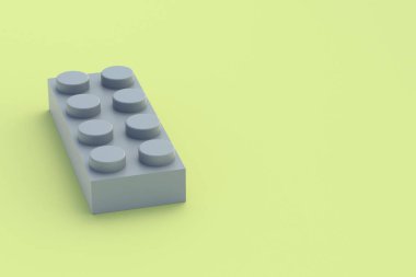 Sarı arka planda gri plastik oyuncak bloğu. Gelişmekte olan çocuklar için dikdörtgen şekilli yapıcı. Anaokulunda eğitim için tuğla. İnşaatçılar için bir parça. Uzayı kopyala 3d oluşturma