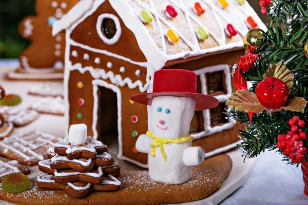 Gingerbread house and a snowman from marshmollow