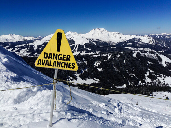 Avalanche danger sign in a mountain landscape