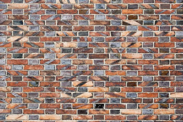 Oude verweerde bakstenen muur — Stockfoto