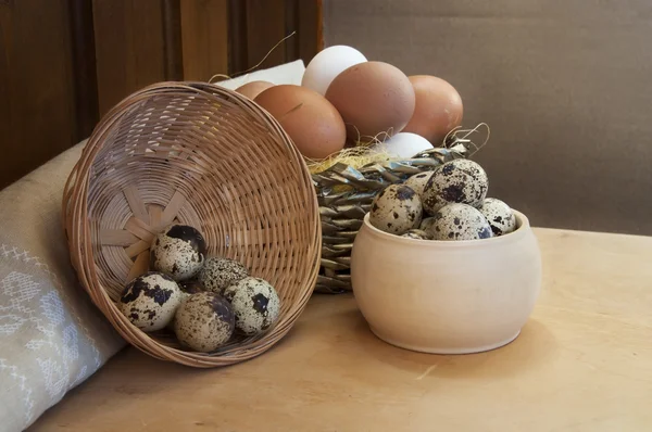 Chicken and quail eggs, healthy food with chicken farm on the table — Stock Photo, Image