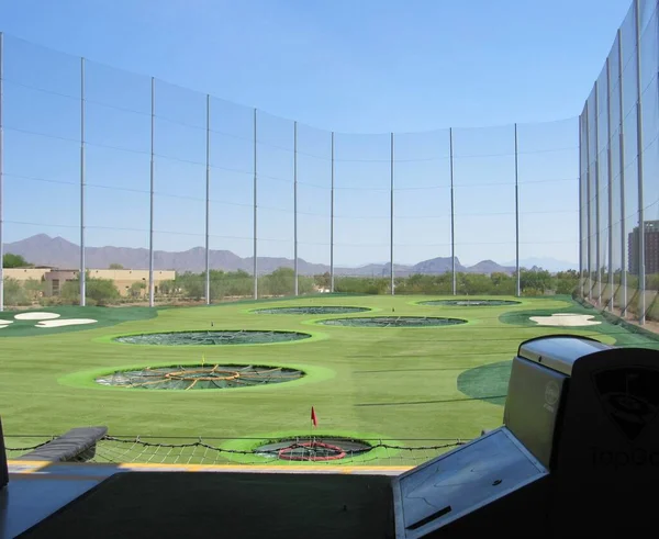 Overlook from a golf driving range located in Scottsdale, Arizona on a sunny day with blue sky