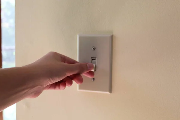 Closeup Person Flipping Light Switch Beige Wall House — Stock Photo, Image