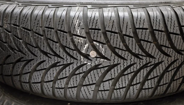 Nail in tyre — Stock Photo, Image