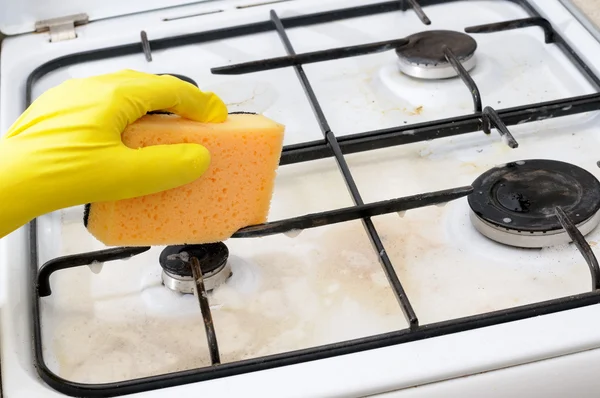 Cleaning of dirty gas stove burner — Stock Photo, Image