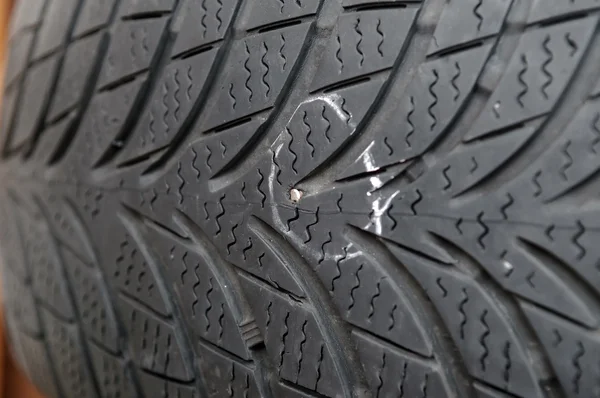 Nail in tyre — Stock Photo, Image