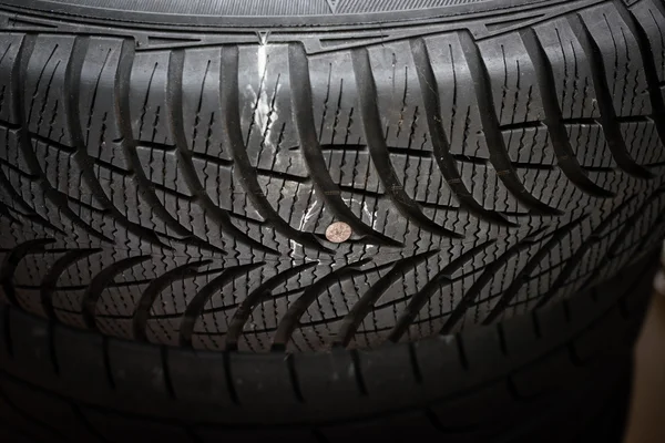 Nail in tyre — Stock Photo, Image