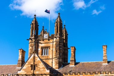 Sydney Uni building facade with Australian flag 