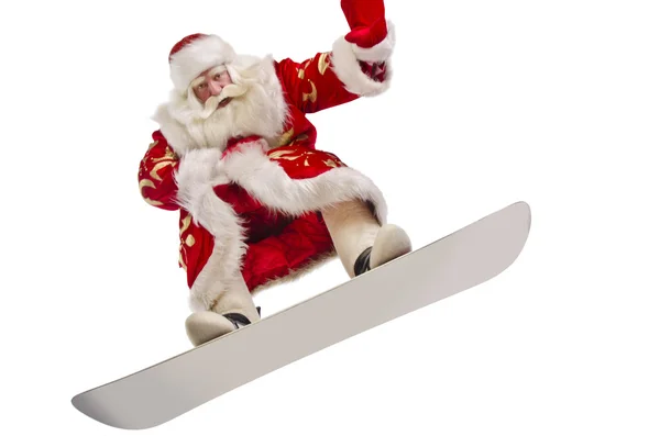 Santa está volando su tabla de snowboard — Foto de Stock