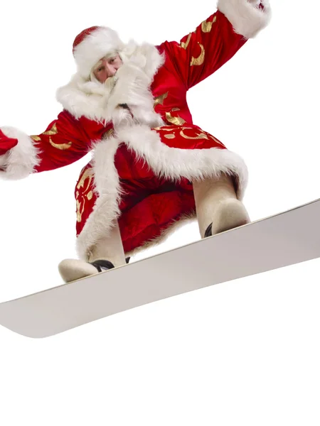 Santa letí jeho snowboard — Stock fotografie