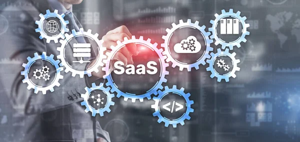 SaaS Software jako koncepcja usługi z ręcznym naciśnięciem tekstu — Zdjęcie stockowe