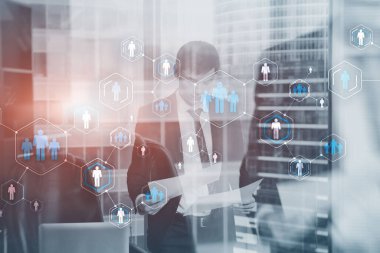 Ofiste çalışan iş adamlarının geçmişinde mavi insanlar simgeleri var.