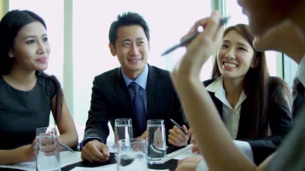 Asian business people having meeting in boardroom — Stock Video