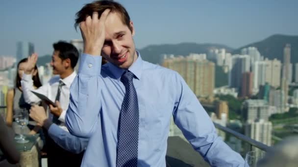 Multi ethnic business people on rooftop — Stock Video