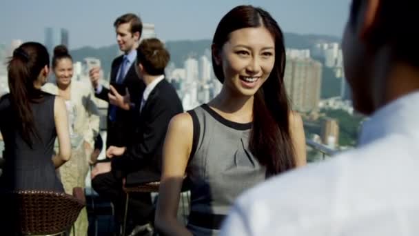 Multi ethnic business people on rooftop — Stock Video