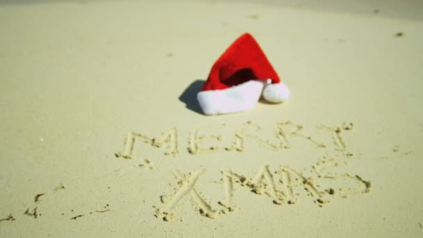 Joyeux Noël salutation écrite dans le sable — Video