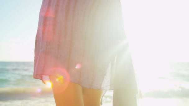 Girl walking barefoot through ocean shallows — Stock Video