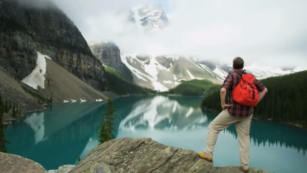 Hiking Man Looking at Moraine Lake — Stock Video