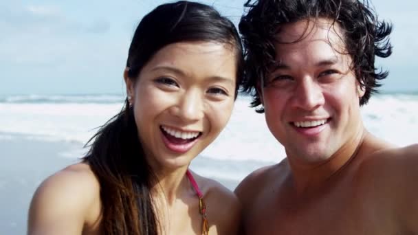 Couple having fun on beach — Stock Video