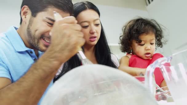 Couple with daughter preparing ingredients for baking — Stock Video