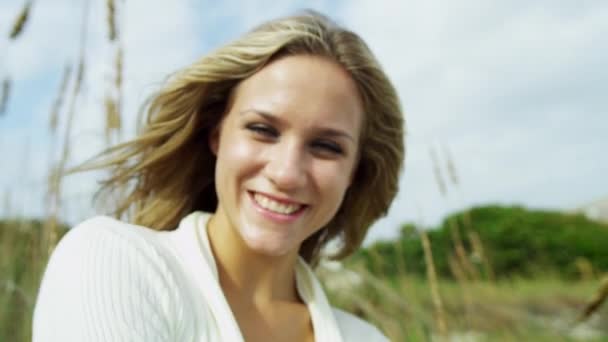 Girl enjoying time alone on beach Royalty Free Stock Video