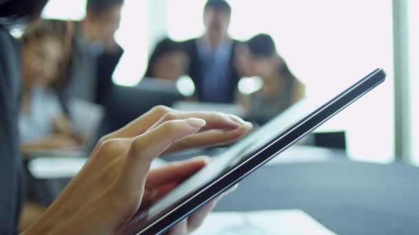 Businesswoman using wireless tablet in boardroom — Stock Video