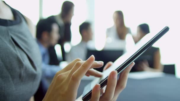 Businesswoman using wireless tablet in boardroom — Stock Video