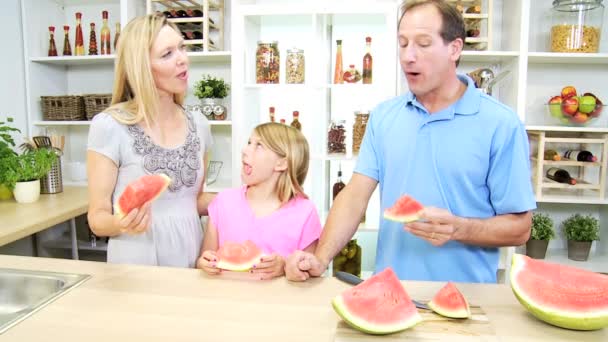 Parents and daughter sharing watermelon — Stock Video