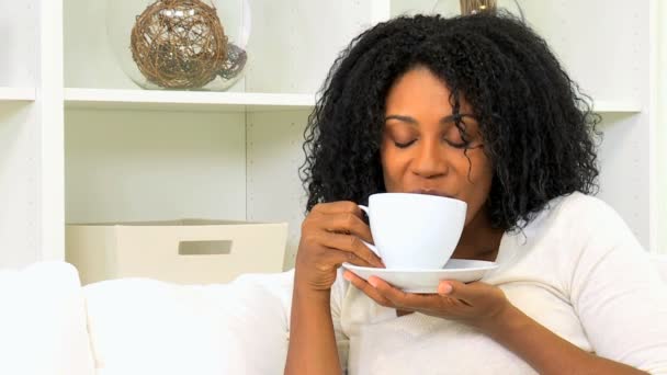 Woman enjoying cup of coffee at home — Stock Video