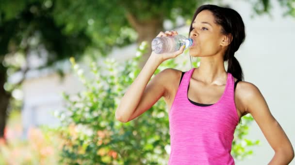 Woman drinks water during training — Stock Video