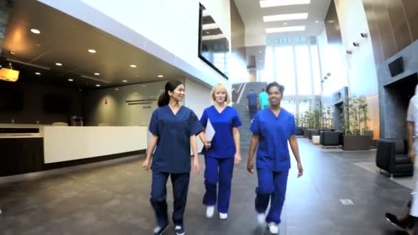 Multi ethnic nurses in hospital entrance — Stock Video