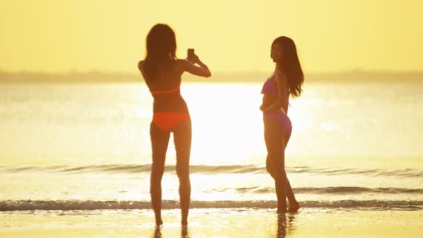 Multi ethnic girlfriends having fun on beach — Stock Video