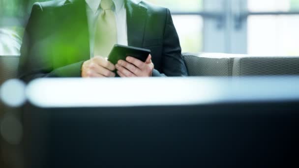 Caucasian businessman in office building using tablet — Stock Video