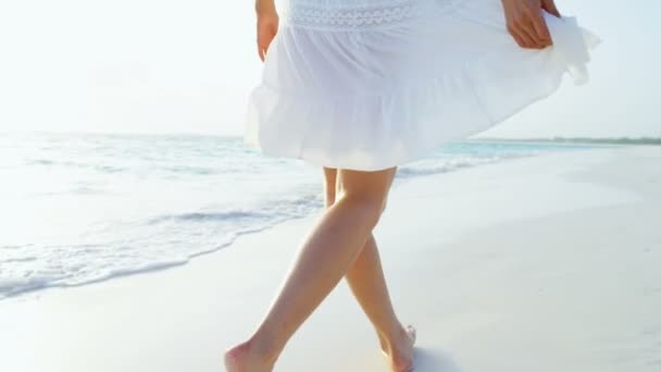 Woman barefoot walking on sandy beach — Stock Video