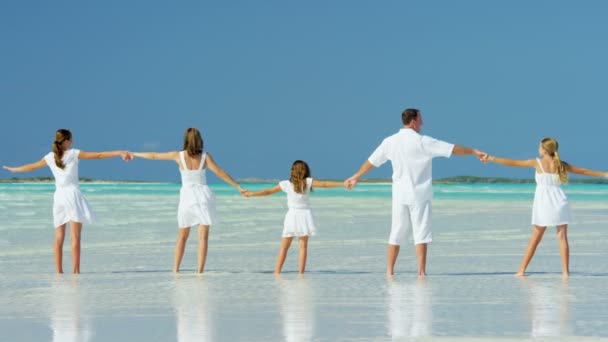 Caucasian family enjoying beach vacation — Stock Video