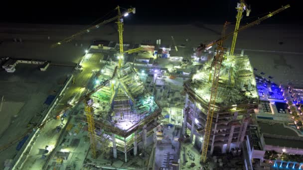 Construction site with workers at night — стокове відео