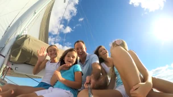 Parents with daughters having fun on yacht — Stock Video