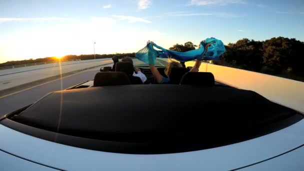 Couple driving in luxury cabriolet car — Stock Video