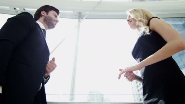 Businesswoman and businessman meeting in Dubai office building — Αρχείο Βίντεο