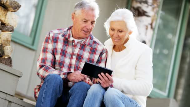 Senior couple using digital tablet — Stock Video