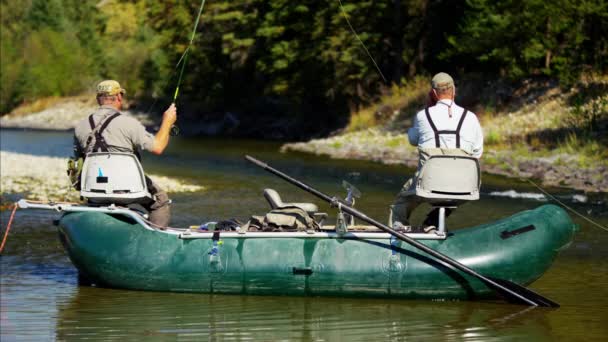 People fly fishing from dingy — Stock Video