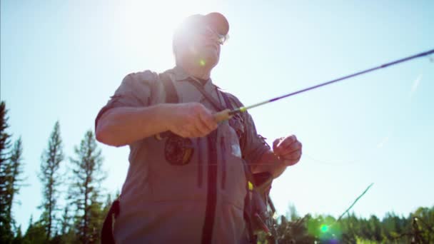 Fisherman casting line in freshwater river — Stock Video