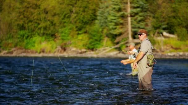 Fisherman casting line in freshwater river — Stock Video