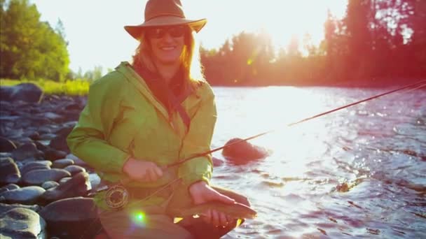 Female fisherman with catch — Stock Video