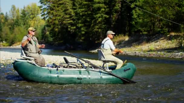 Fly fishing males on freshwater river — Stock Video